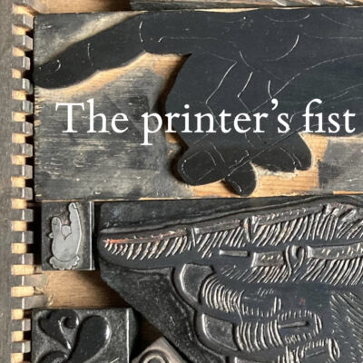 Montage of photos of printer's fists in wood type, with superimposed headline 'The printer's fist'