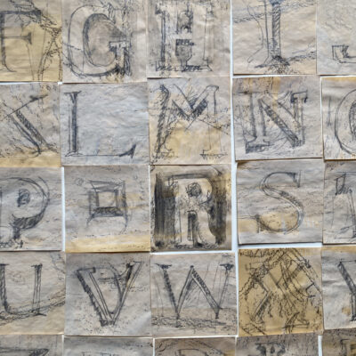 Alphabet sketched from foundation stones on scrap drawings