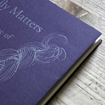 Detail of the printed book photographed on the table used for the illustration