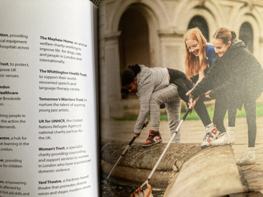 Detail of grants spread showing full page picture of students on a Royal Parks activity facing listings