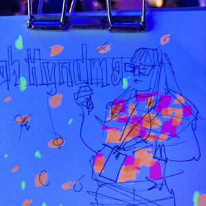 Sketch of Sarah Hyndman speaking, photographed just after drawing, highlighter glowing in the blue light