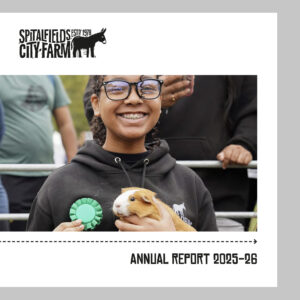 Annual report cover featuring young person at the Farm with chicken