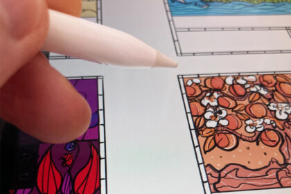 Lydia's hand holding an Apple Pencil, over an iPad screen showing label illustration work in progress